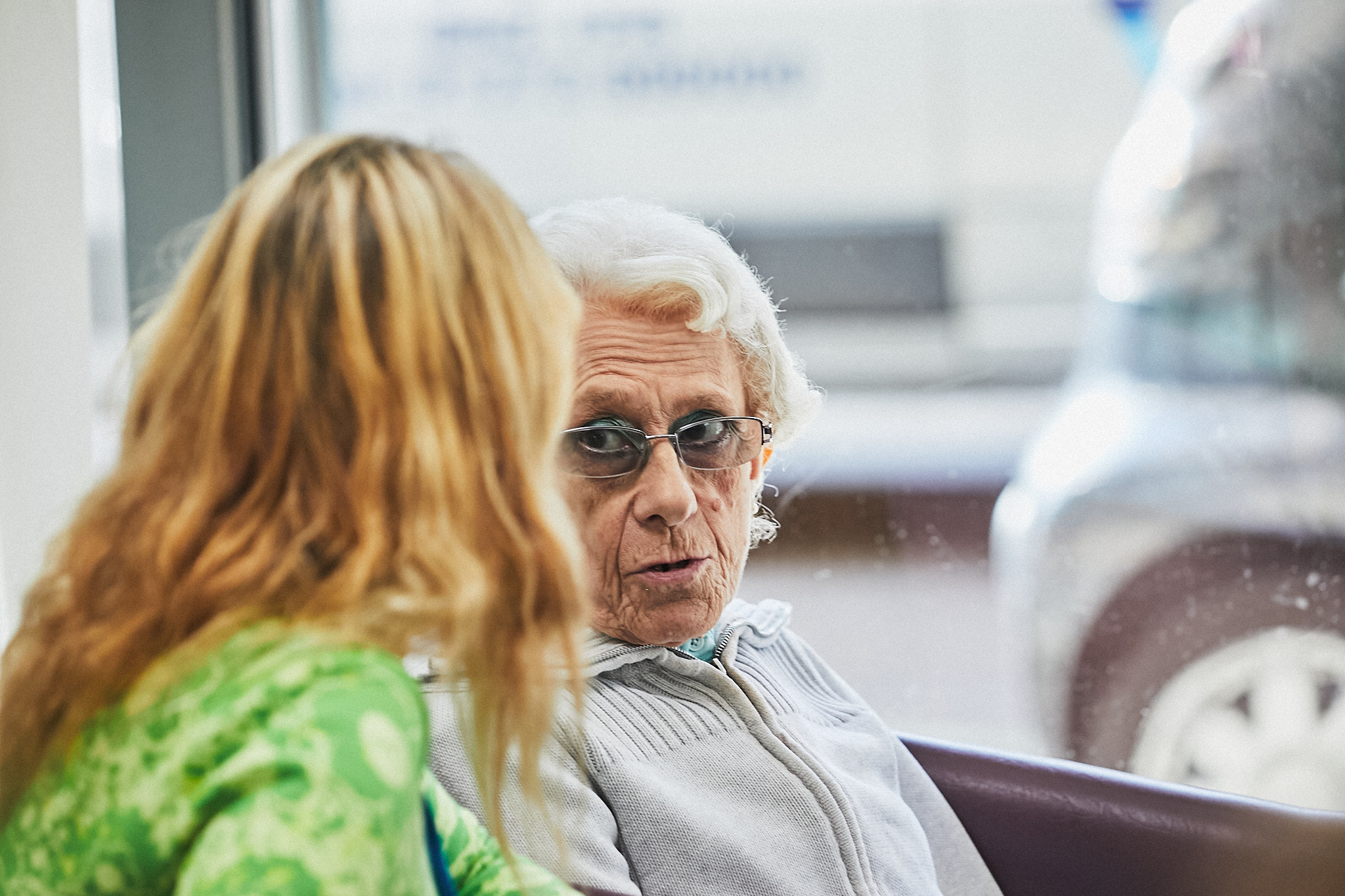 A Memory Assessment Service service user, older woman sat talking to a younger woman