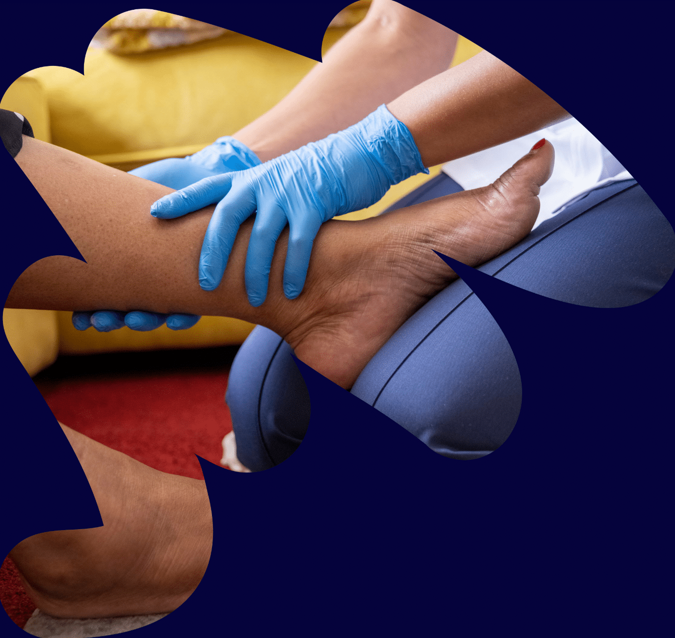 Image of a woman with her foot on a practitioners knee receiving MSK treatment