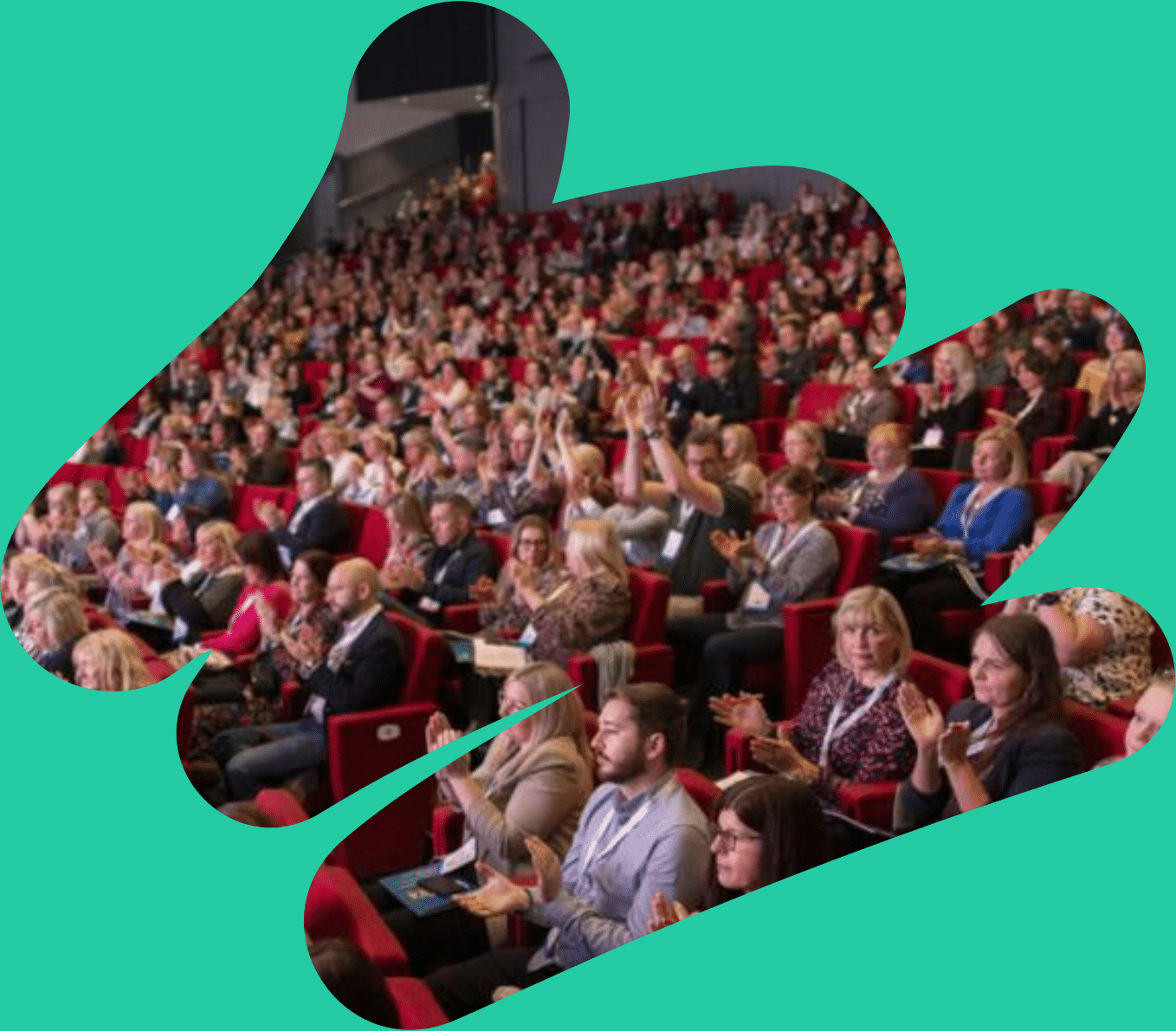 Photo of a large number of people sat at a conference - Hospice UK