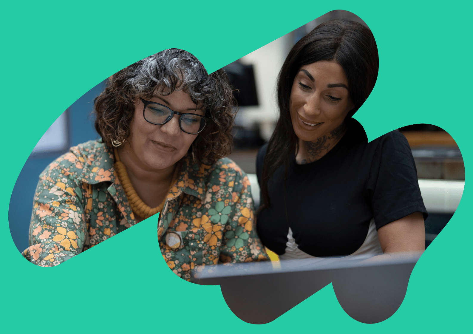 Two women at a laptop